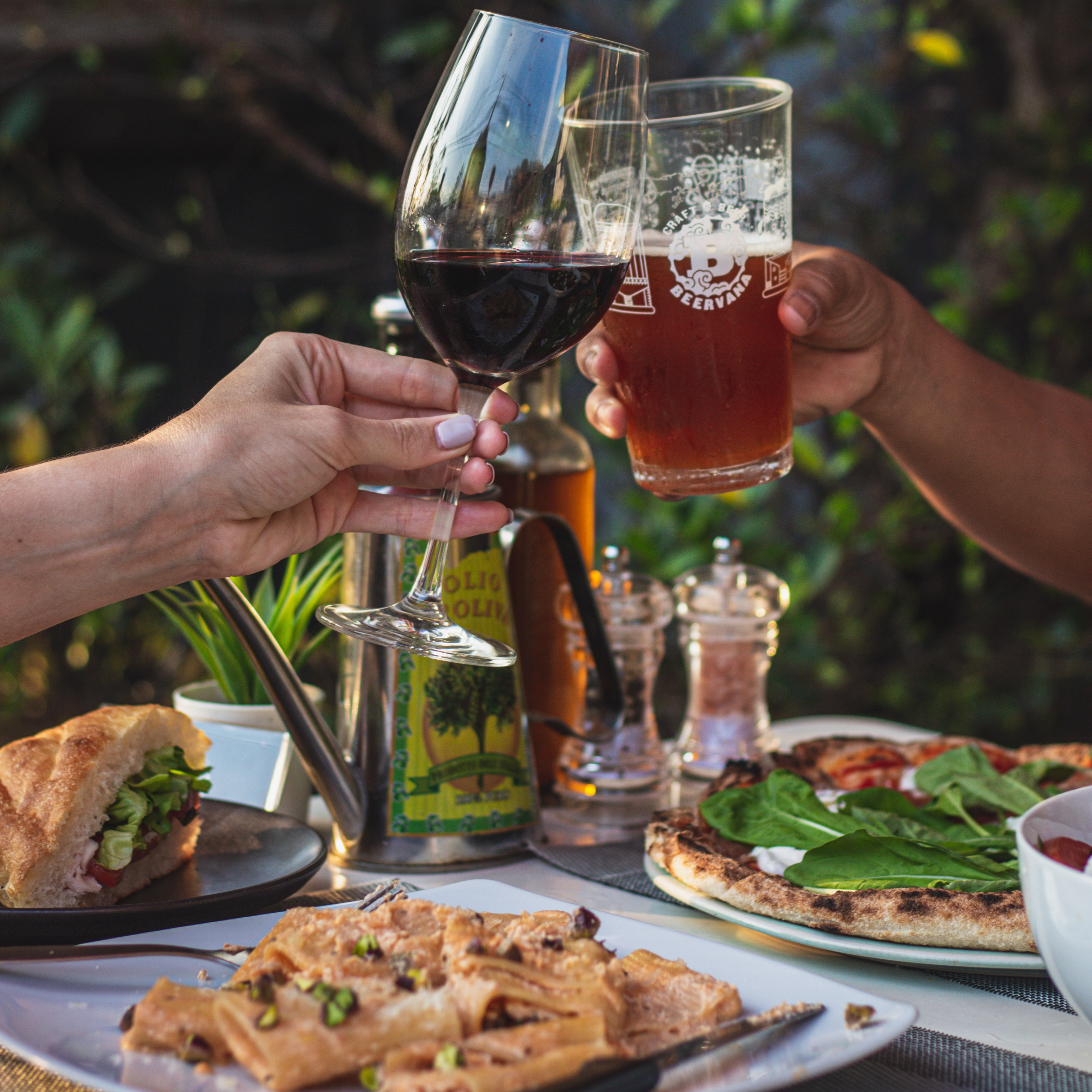 Cheers with wine and beer, Italian feast